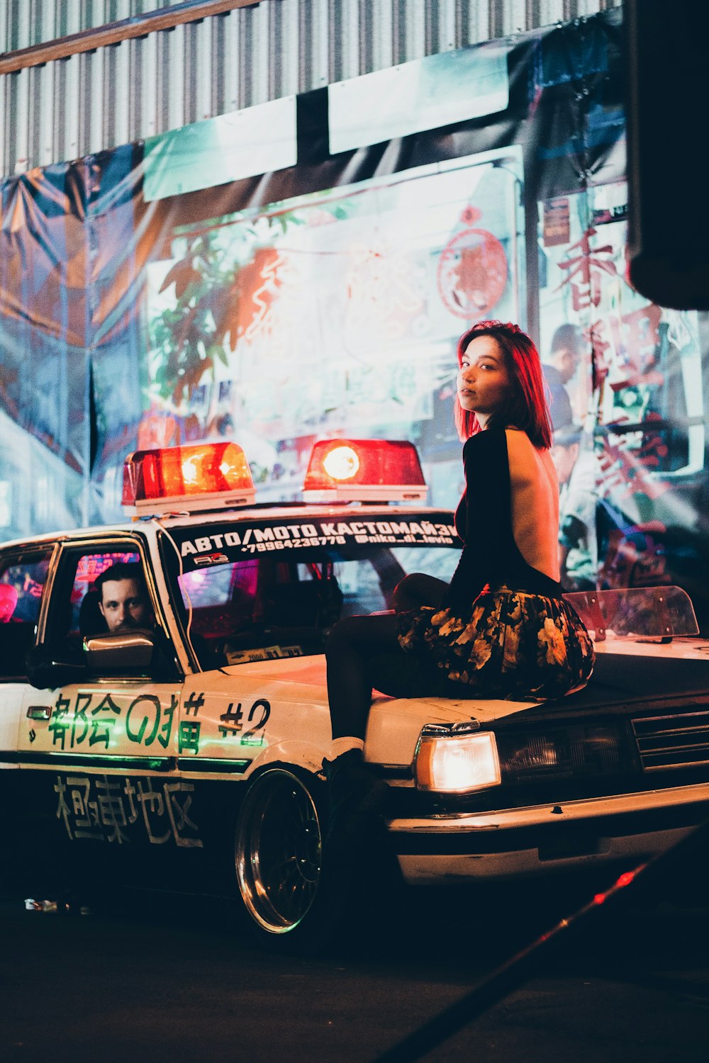 a person sitting on a car