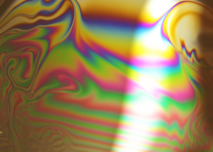 A vibrant resin art piece showcasing swirling colors.