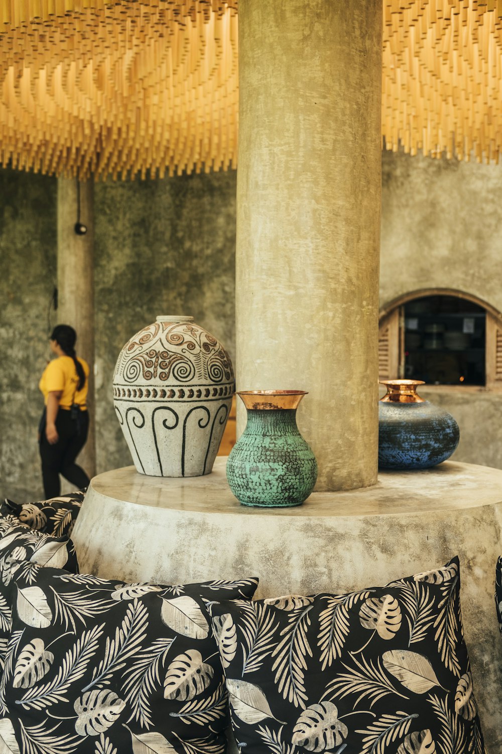 a couple of vases sit on a table