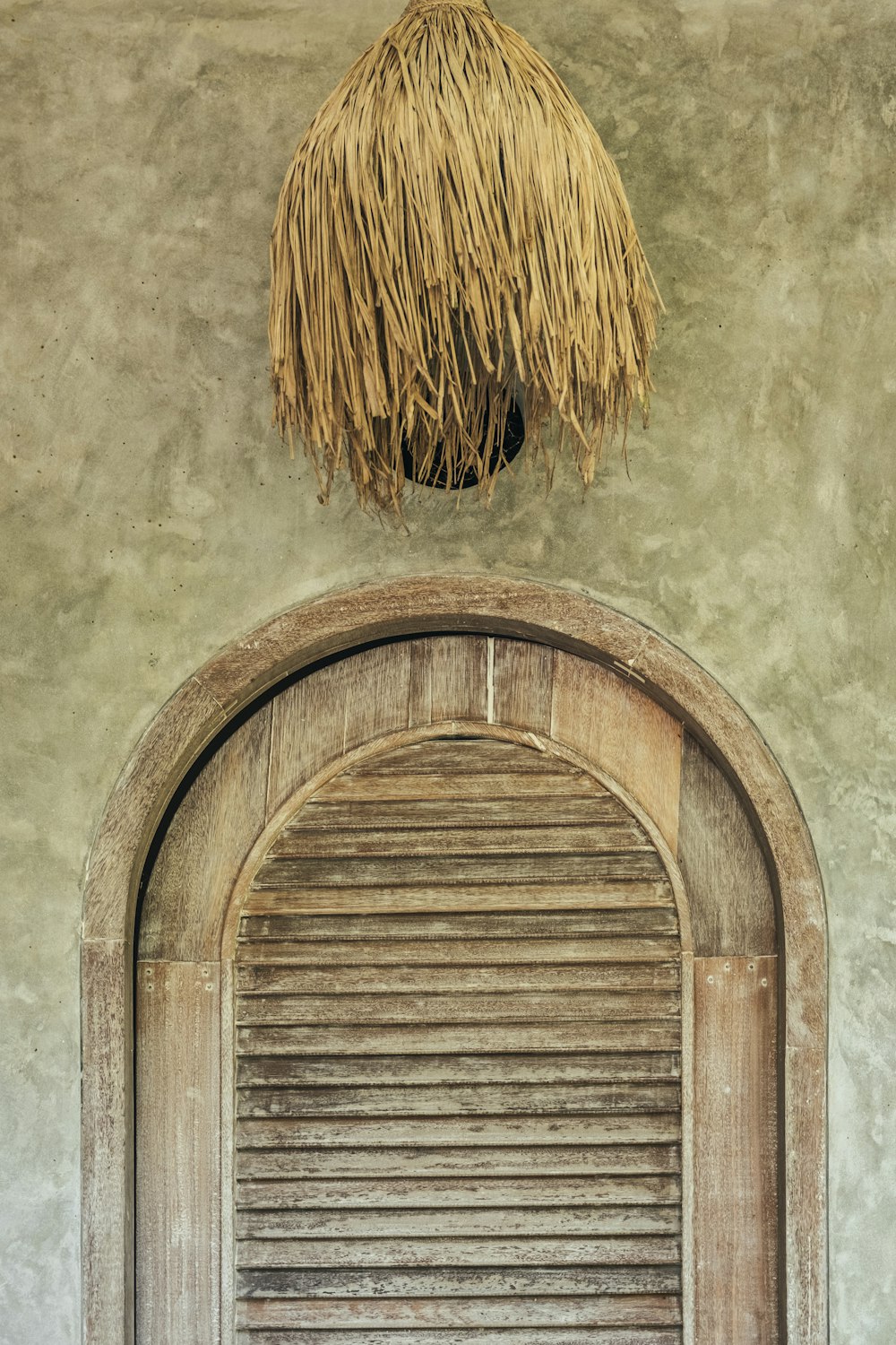 a door with a straw on top