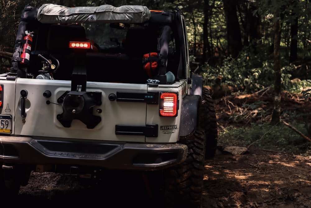 a white truck with a large flat tire