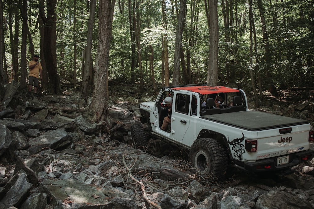 a truck driving through a forest