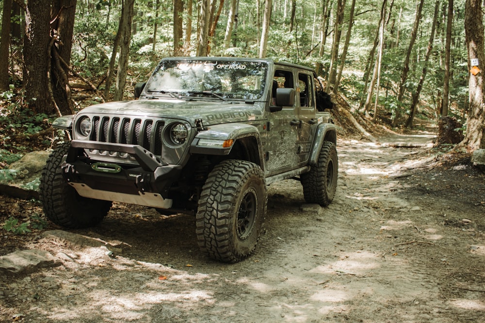 a jeep driving through a forest