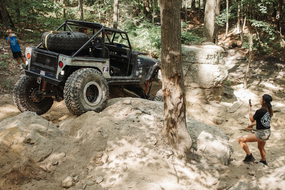 a jeep parked in the woods