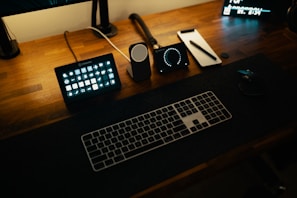 a keyboard and a computer mouse on a desk