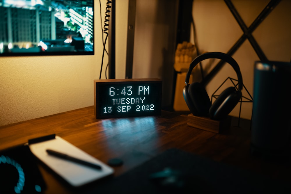 a digital clock on a desk