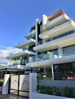 Apartment building entrance with secure access and clean design.