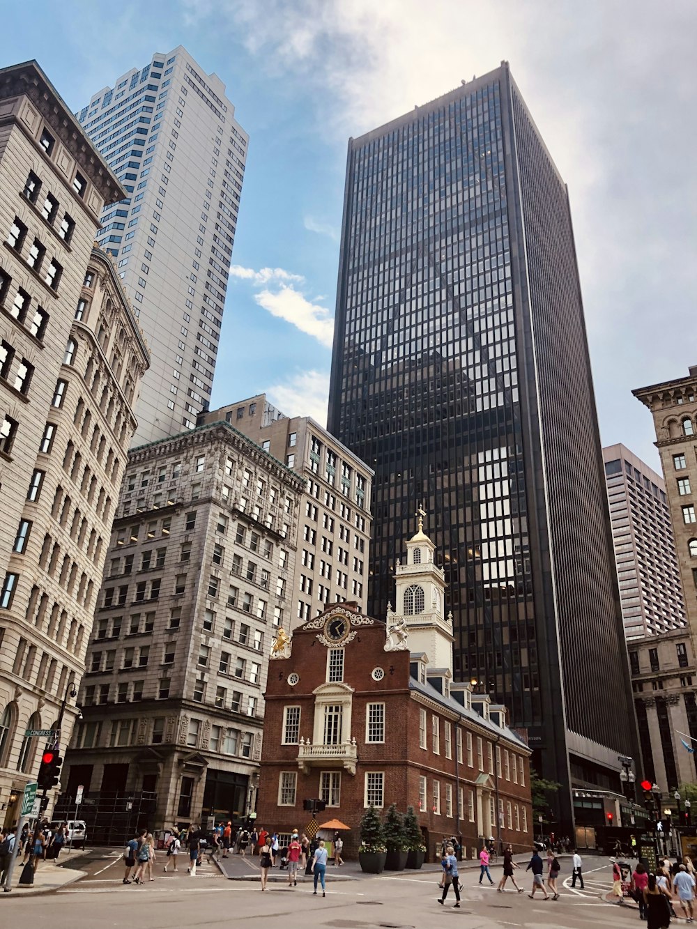 a group of people walking in a city