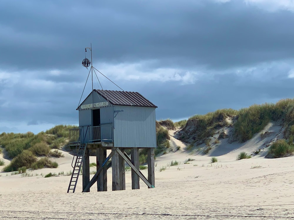 a small building on a beach