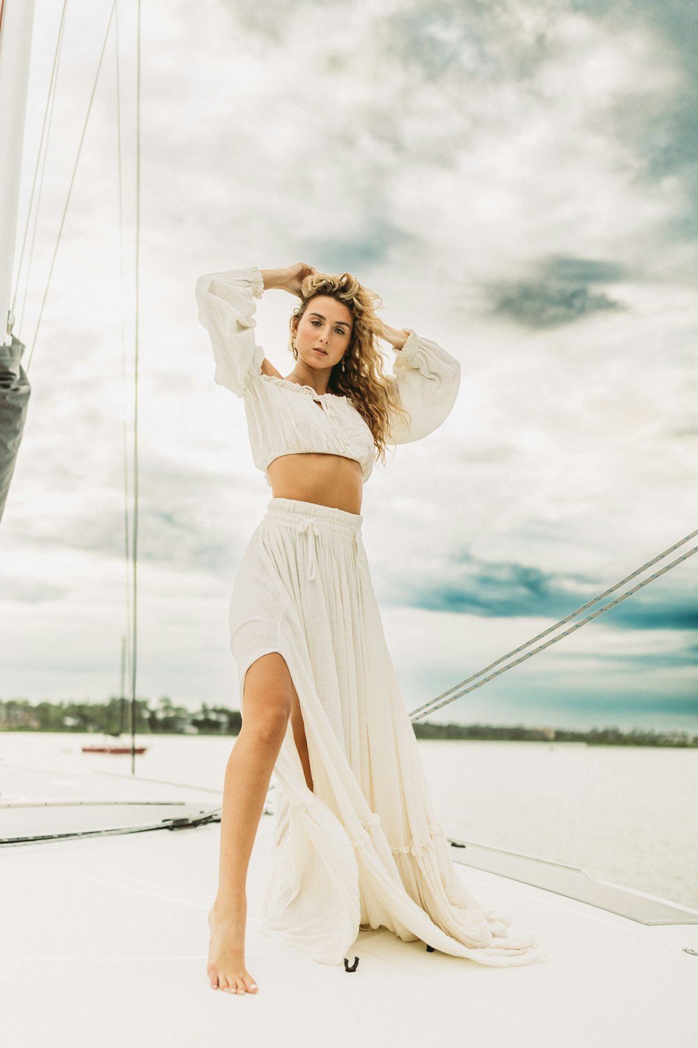 a person in a white dress on a boat