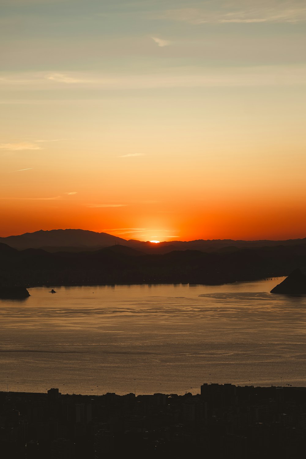 a sunset over a body of water