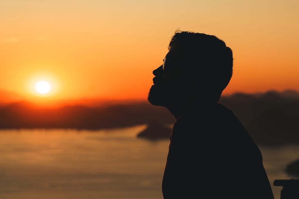 a person looking at the sunset