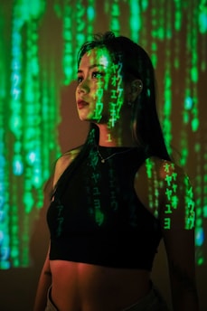 a woman with green paint on her face