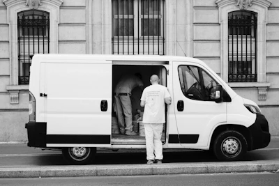 a man standing next to a van