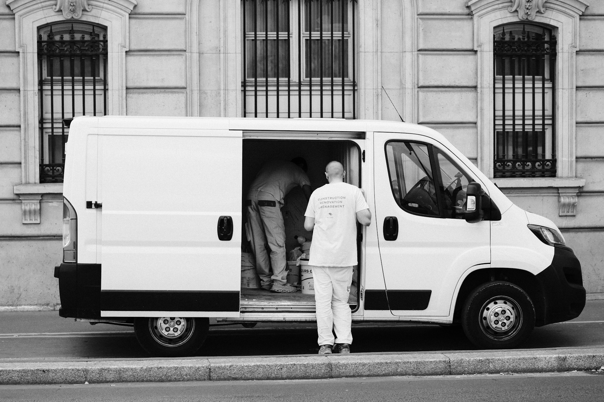 a man standing next to a van