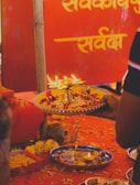 Aarti plate glowing with flickering flames reflecting faith and hope.
