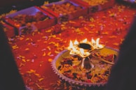 A close-up of a festive Diwali gift hamper glowing with fairy lights.
