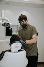 a person wearing a mask and a mask next to a person in a garment