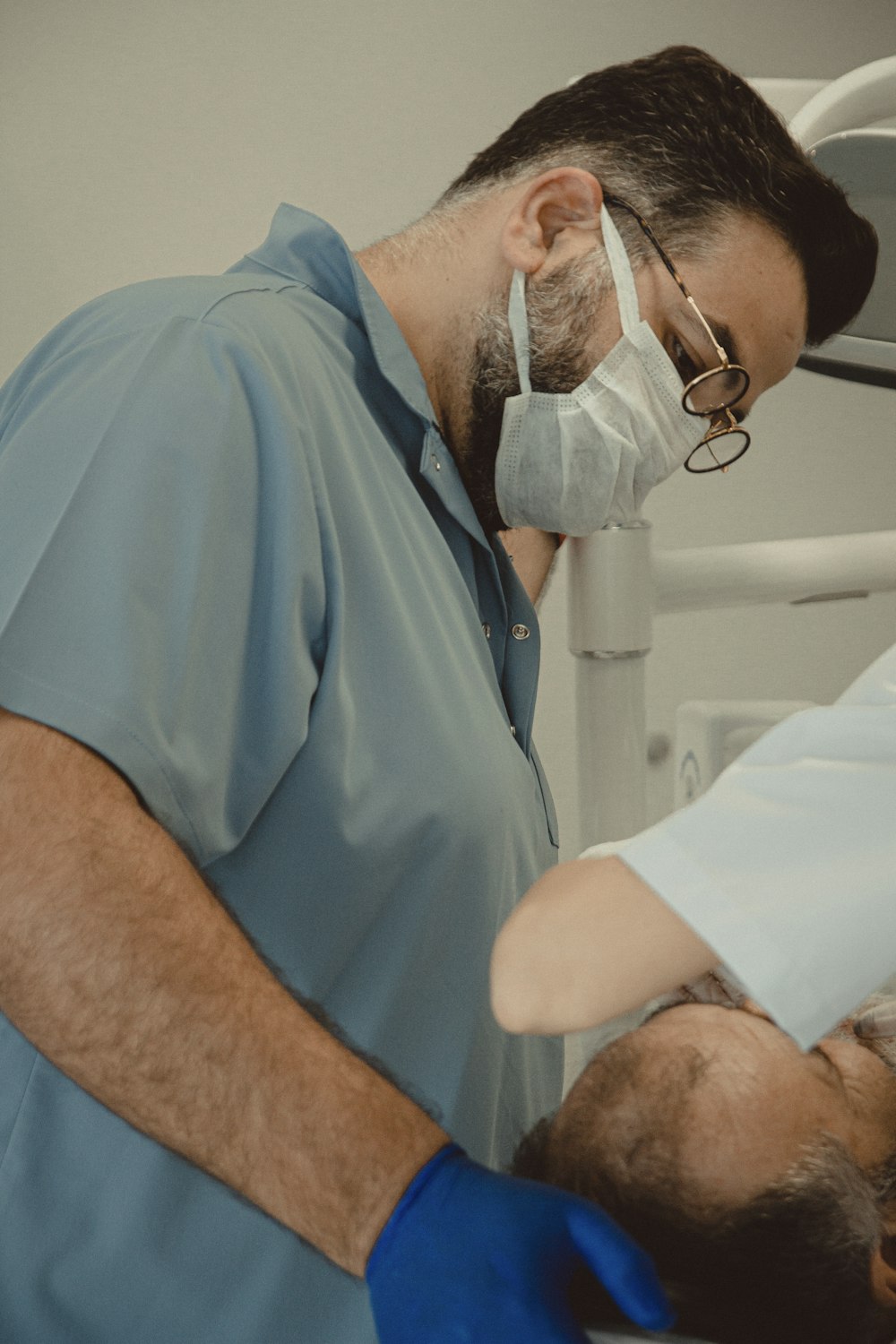 a dentist examining a patient