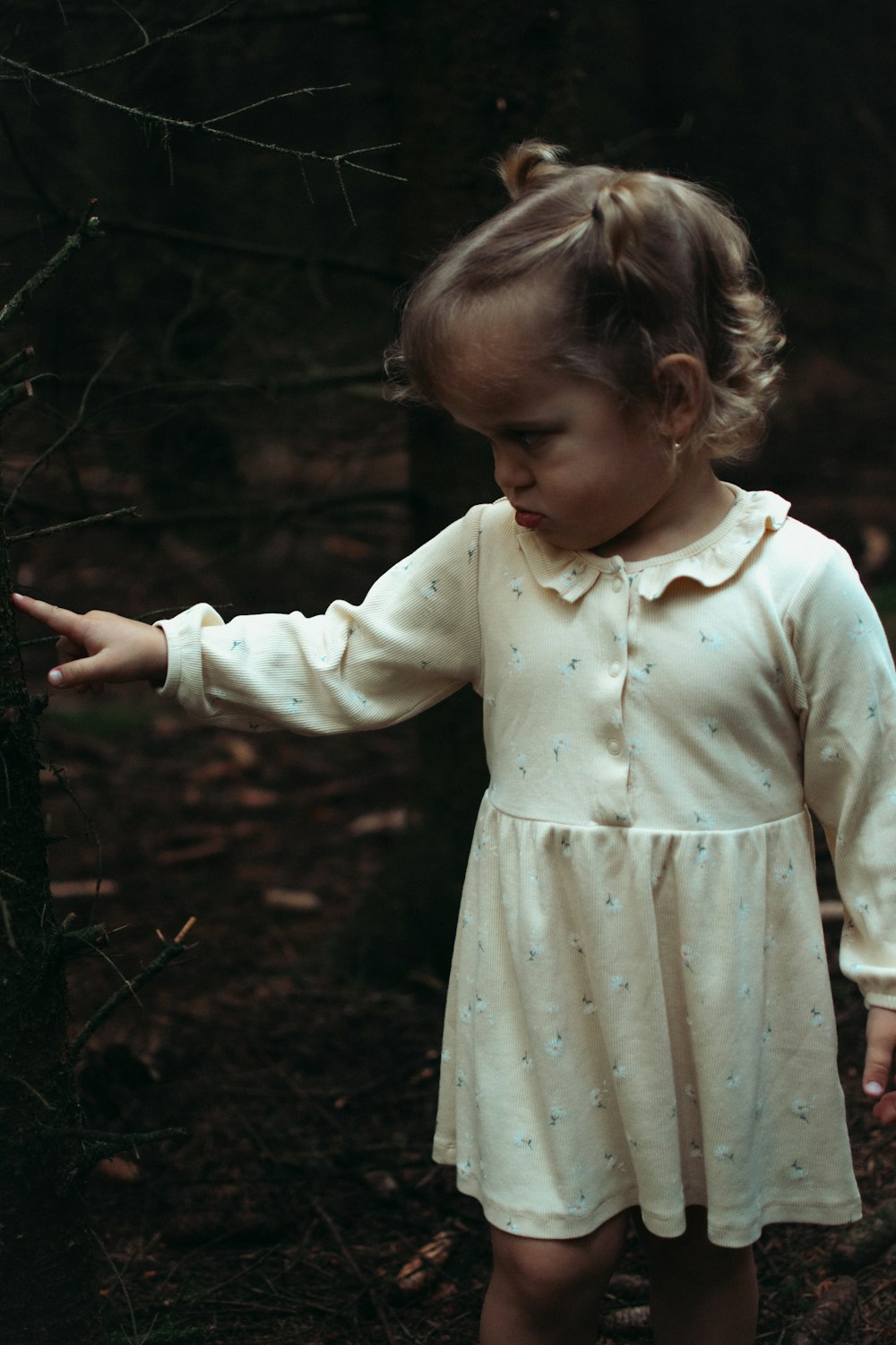 a little girl in a white dress