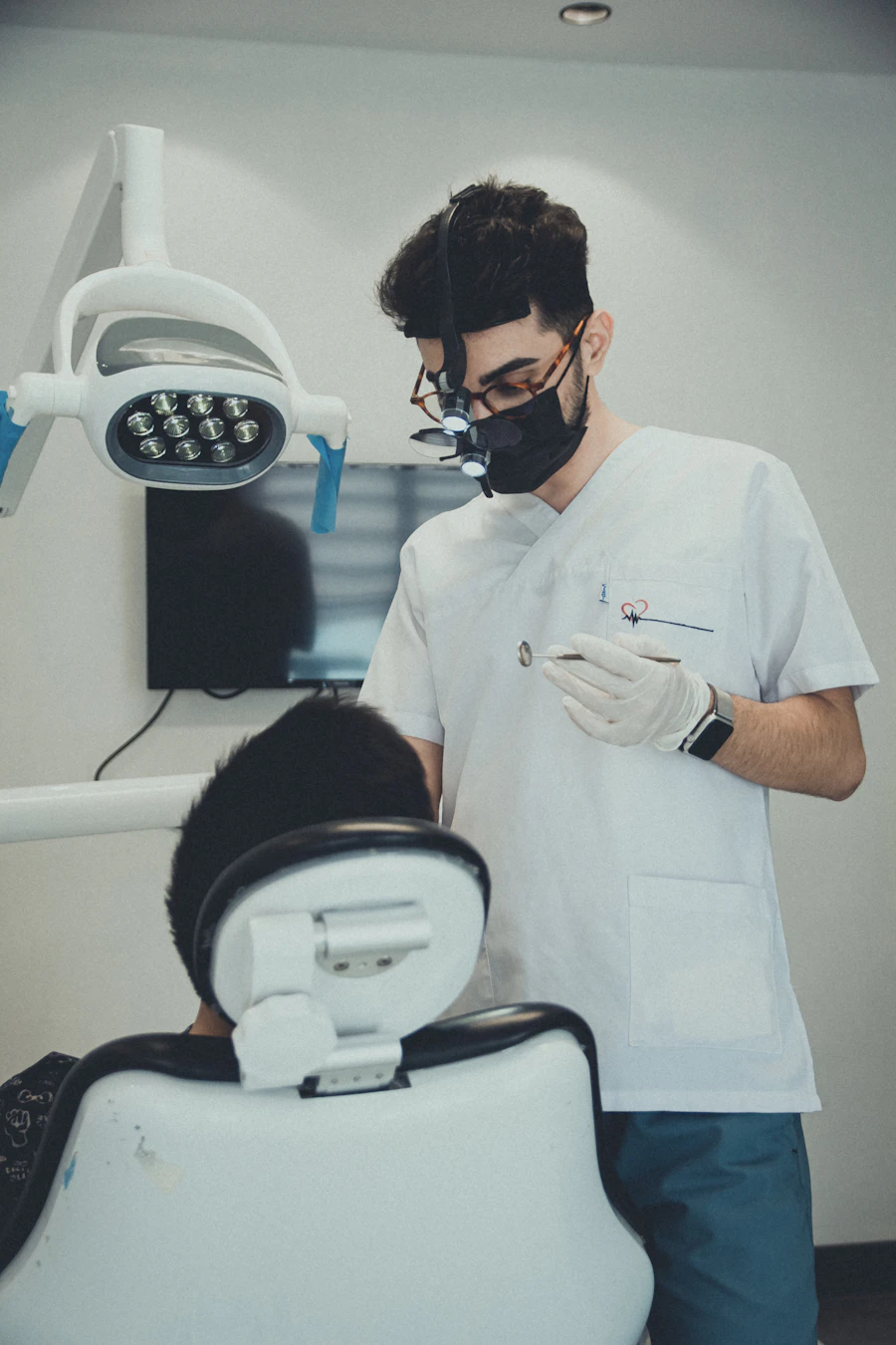 Dental office front desk where a patient reviews a printed treatment estimate