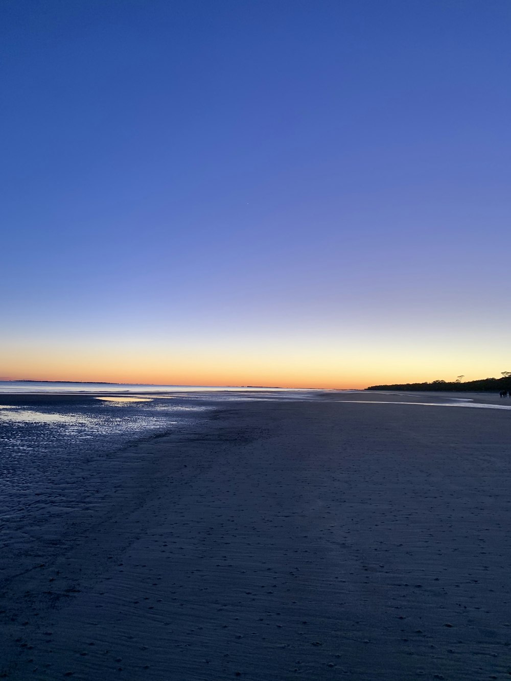 a beach at sunset