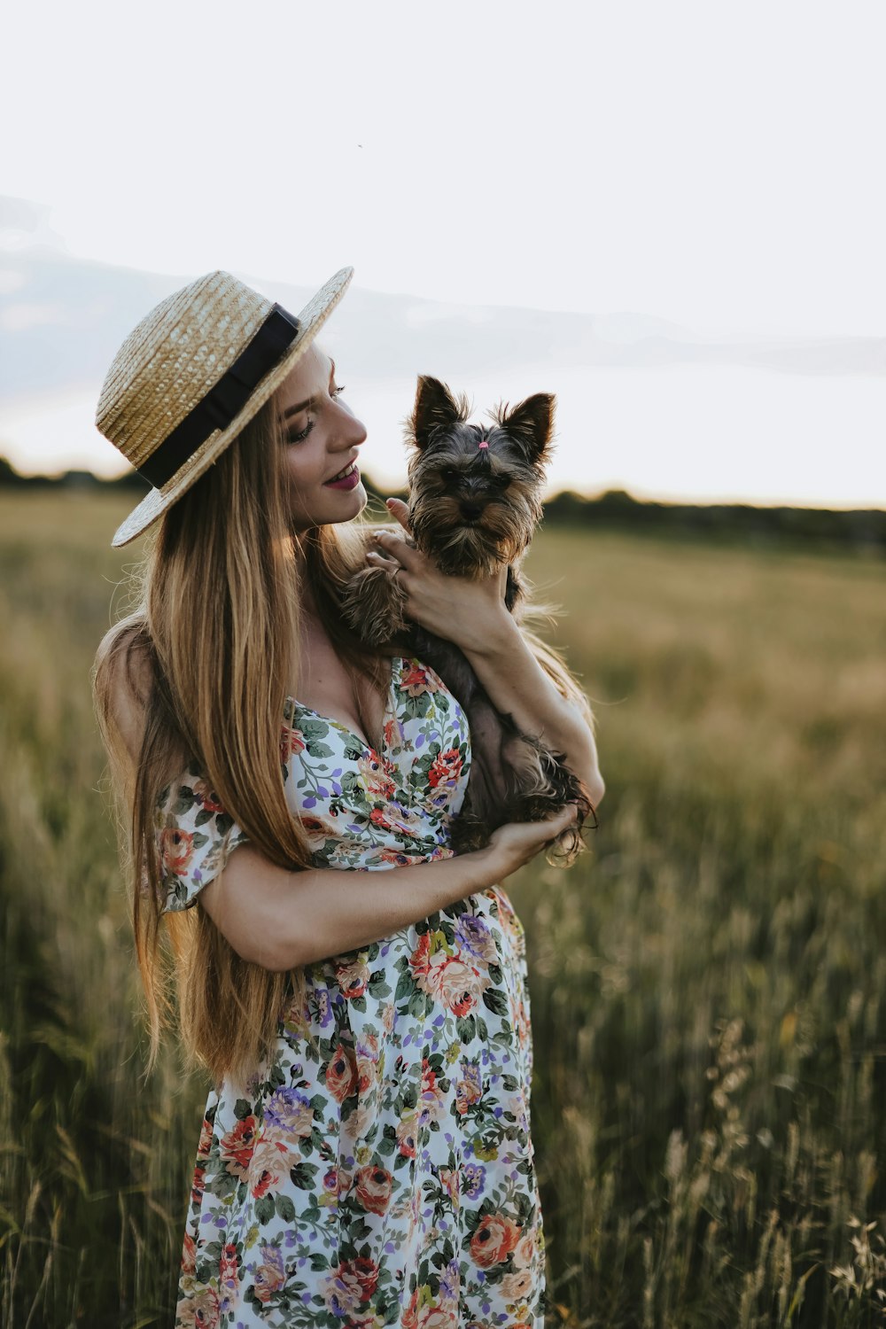 a woman holding a dog