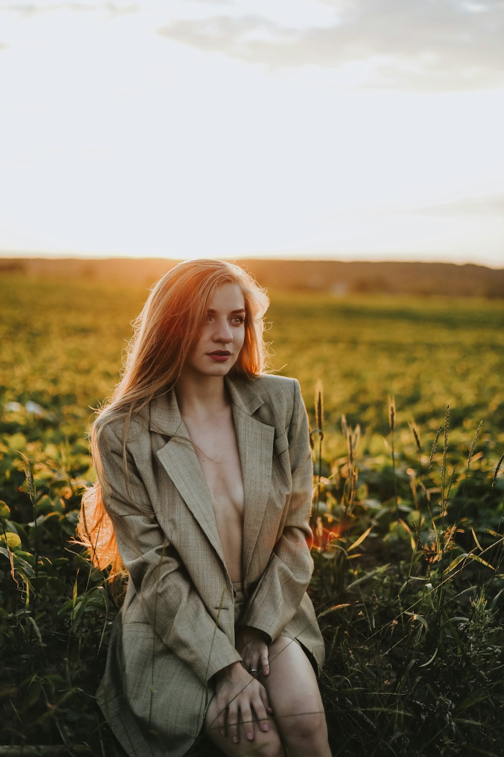 a woman standing in a field