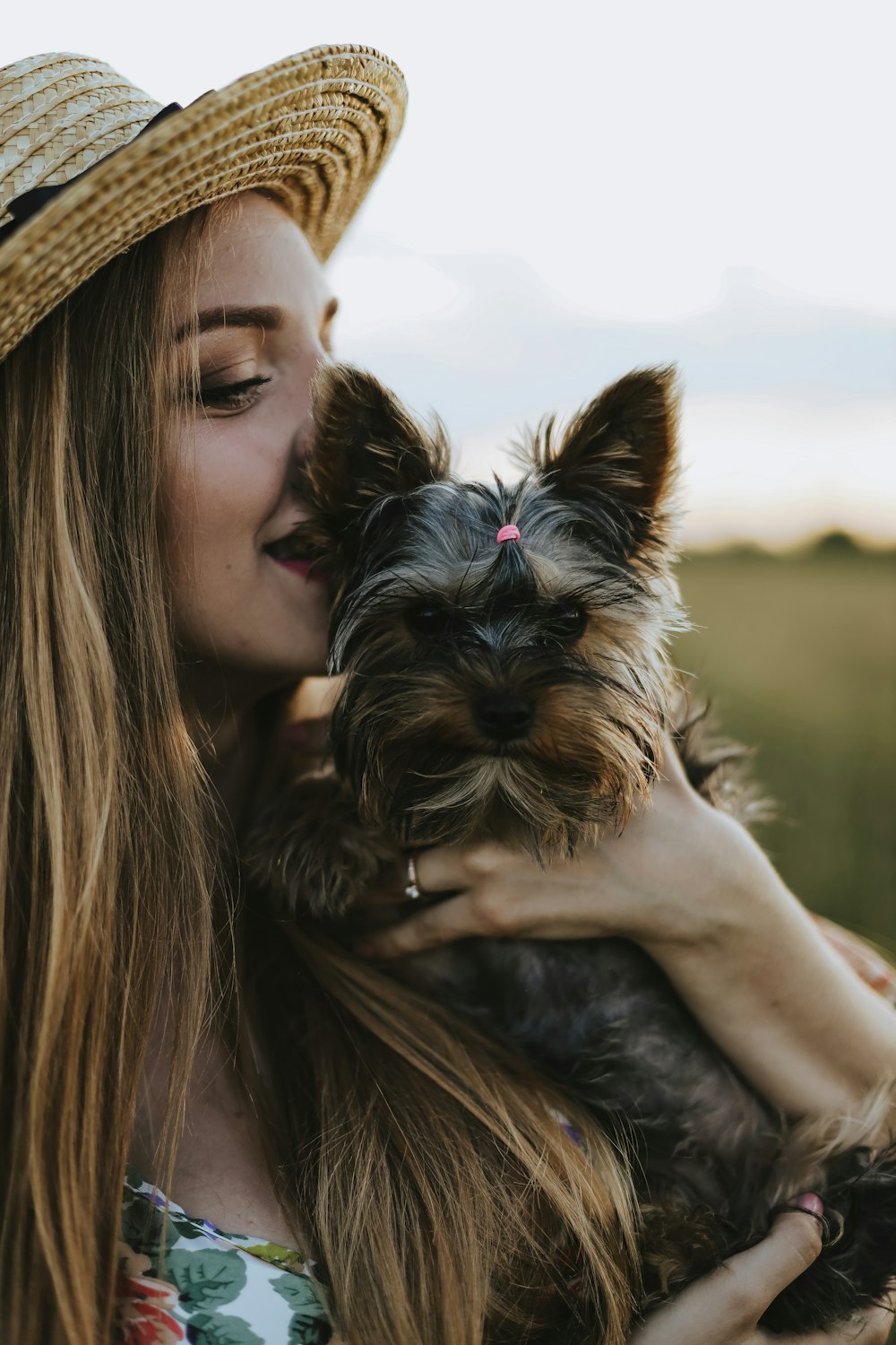 a woman holding a dog