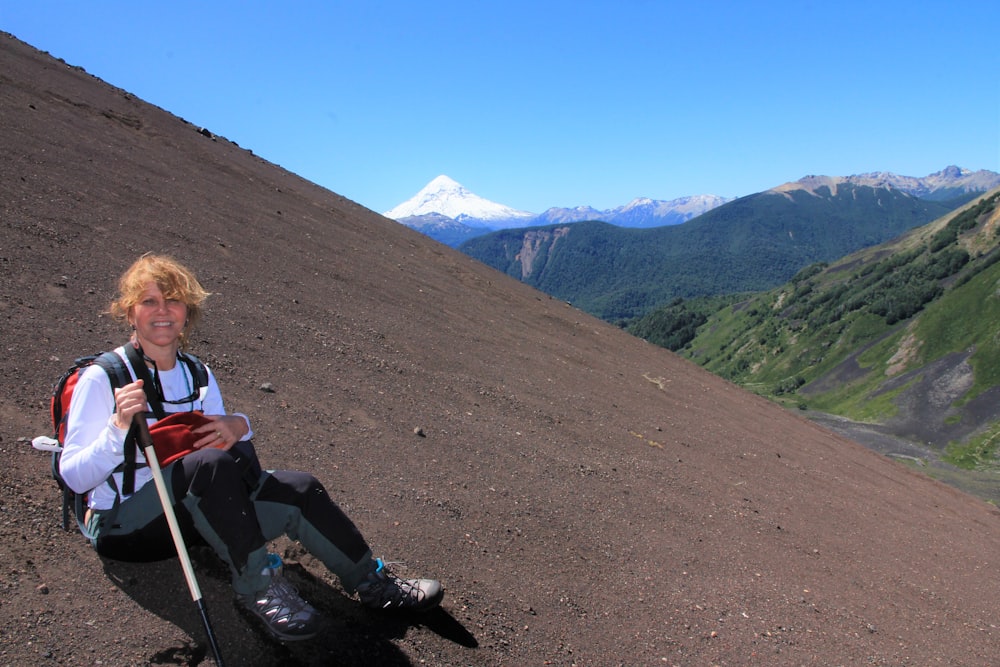 a man sitting on a mountain