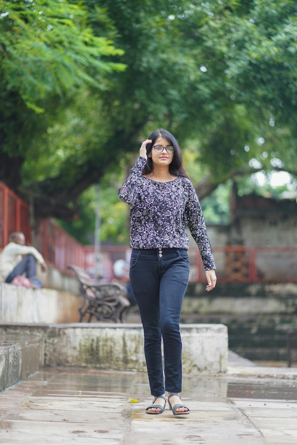 a person standing on a sidewalk