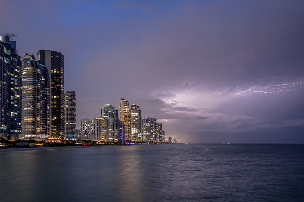 a city skyline by the water