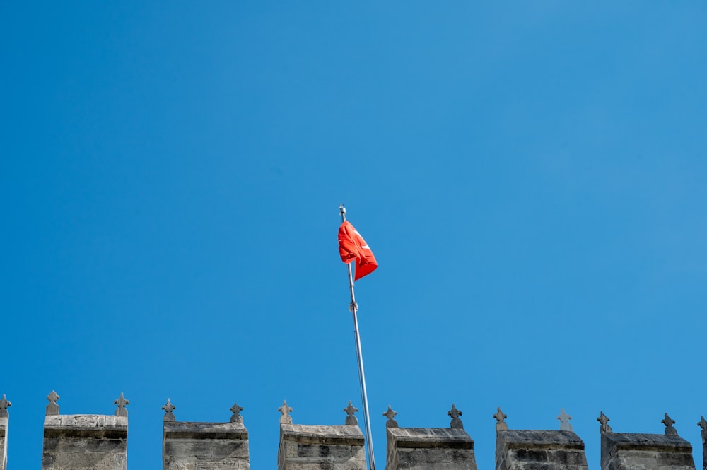 a red flag on a pole