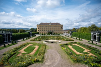 a large building with a garden in front of it