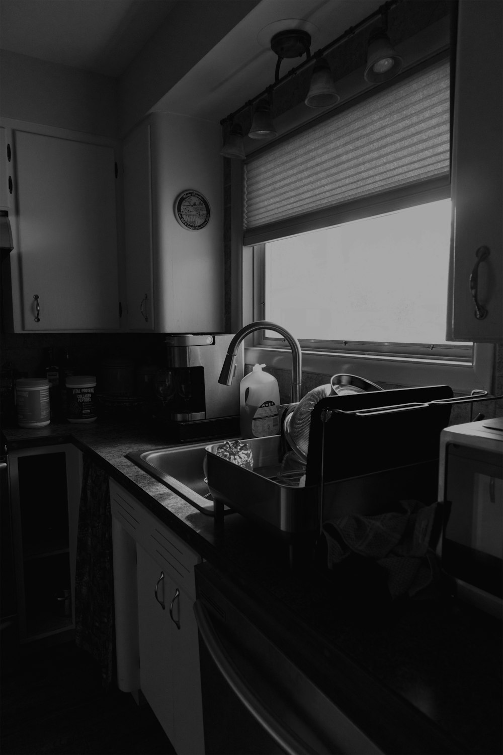 a kitchen with a sink and a window