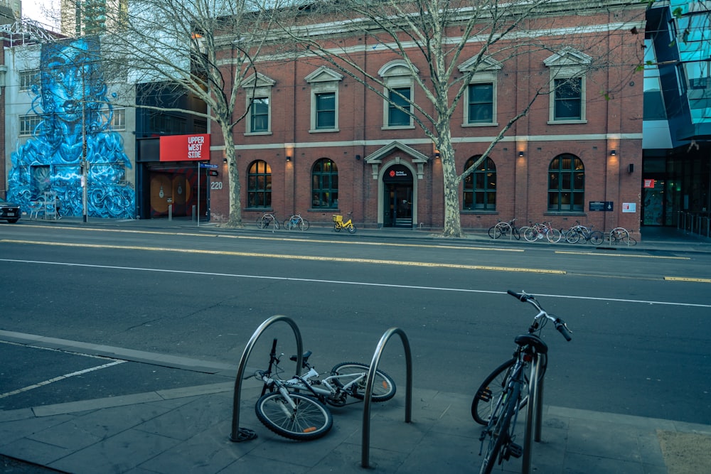 bicycles parked on the side of a street