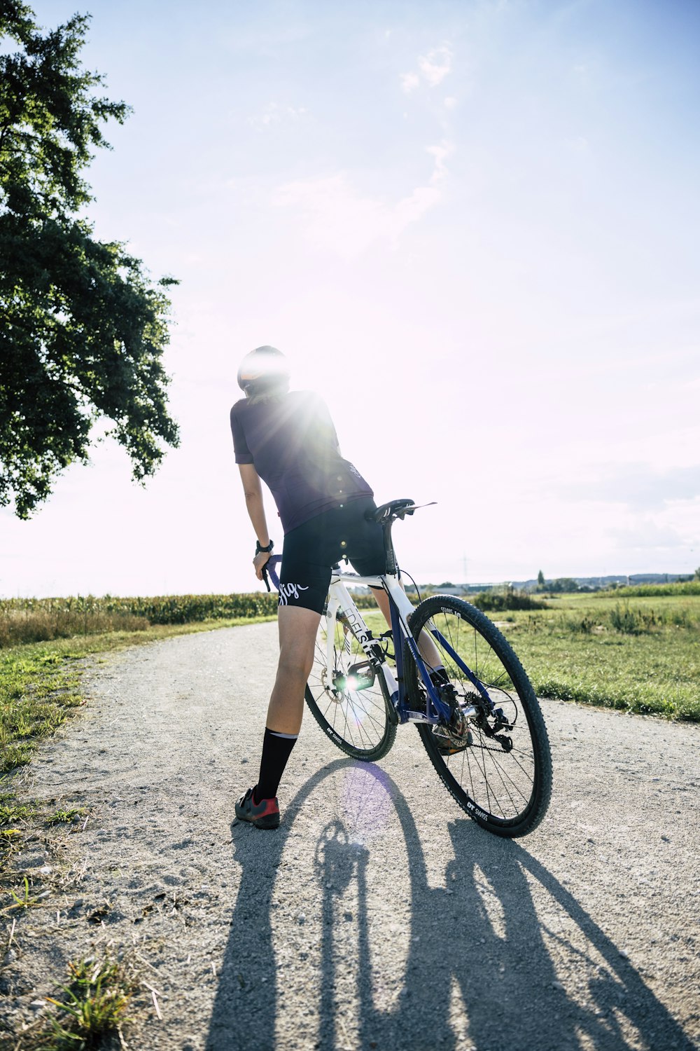 a man riding a bicycle on a road