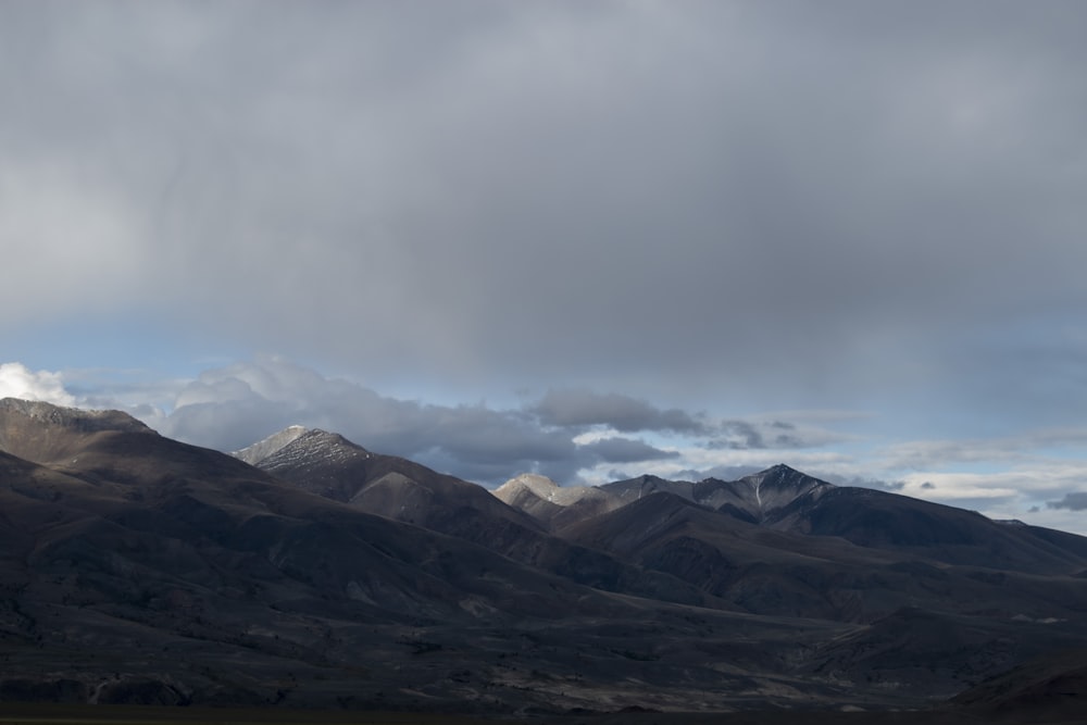 a mountain range with clouds