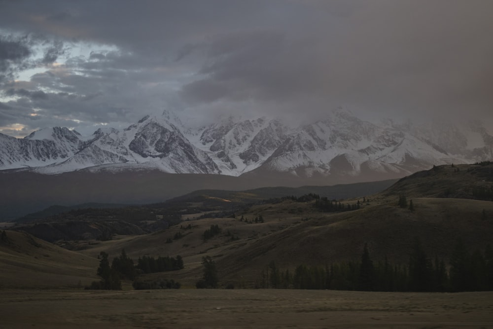 a landscape with mountains in the back