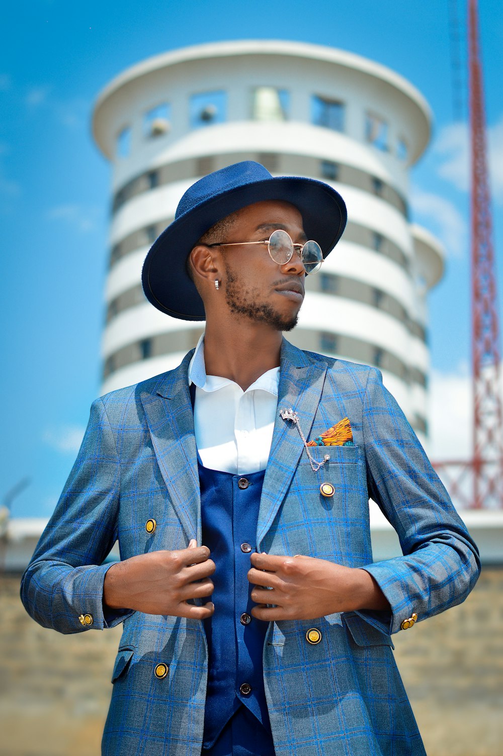 a man wearing a hat and glasses