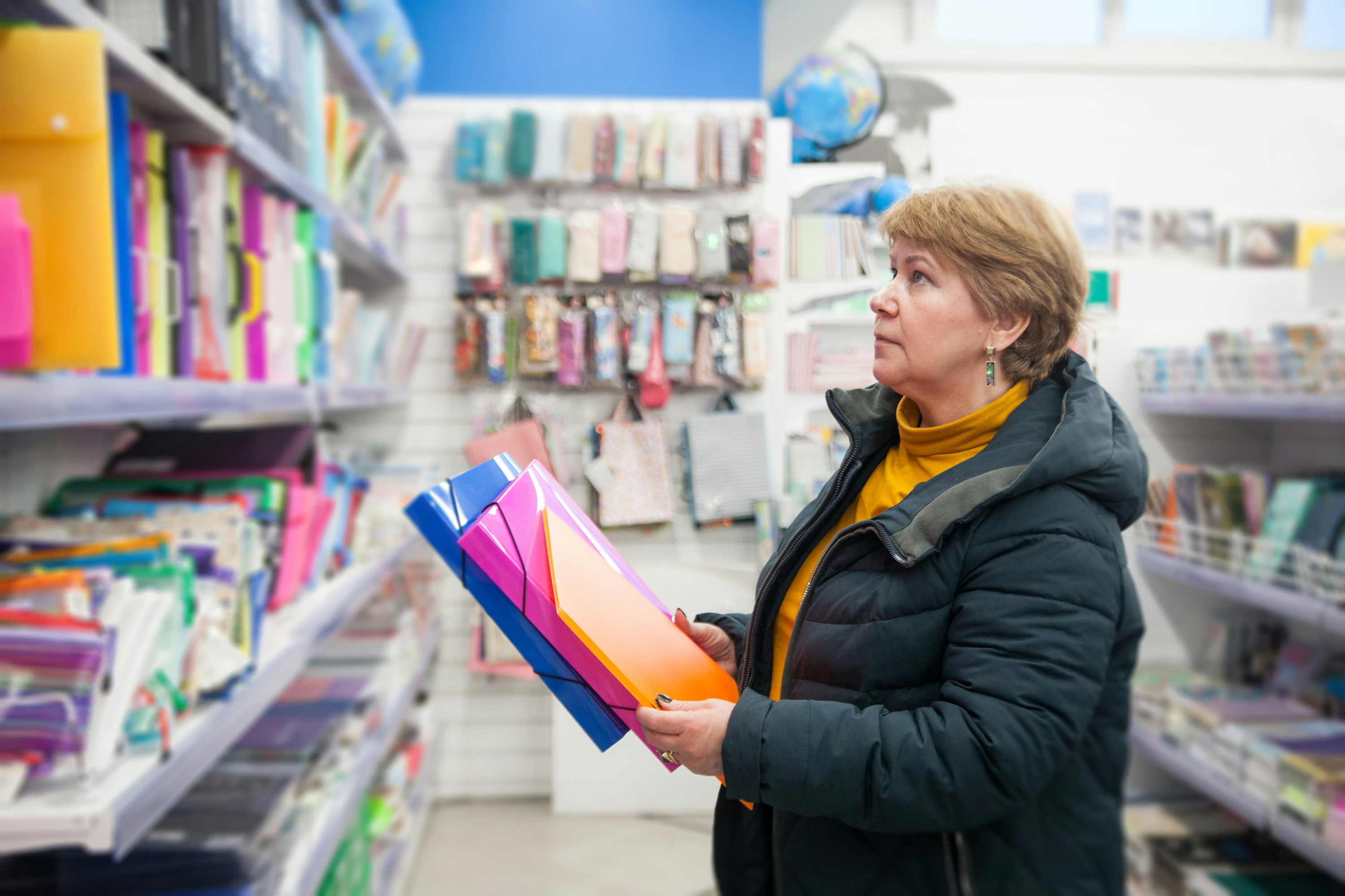 a person holding a book in a store