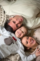 A cozy family gathering with everyone smiling.