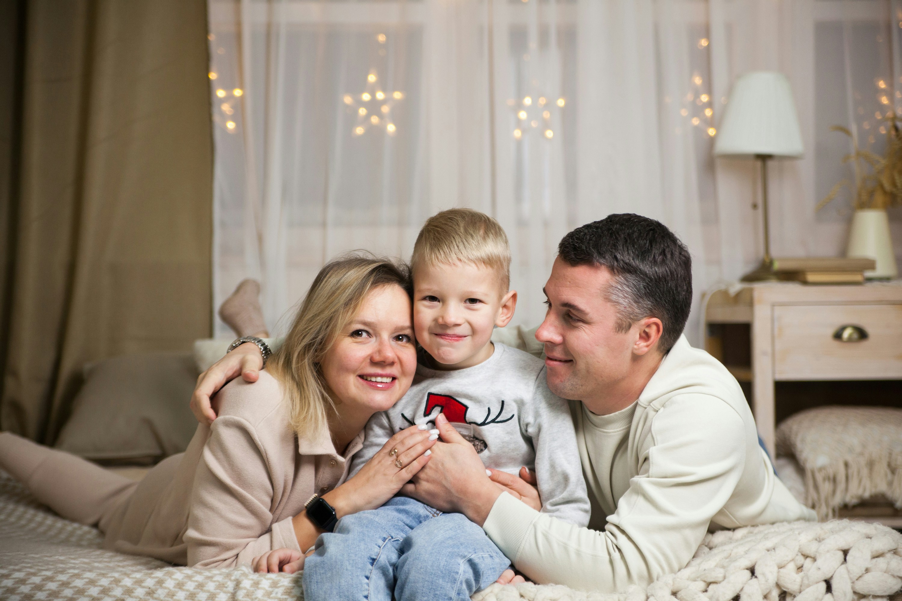 a family sitting on a couch