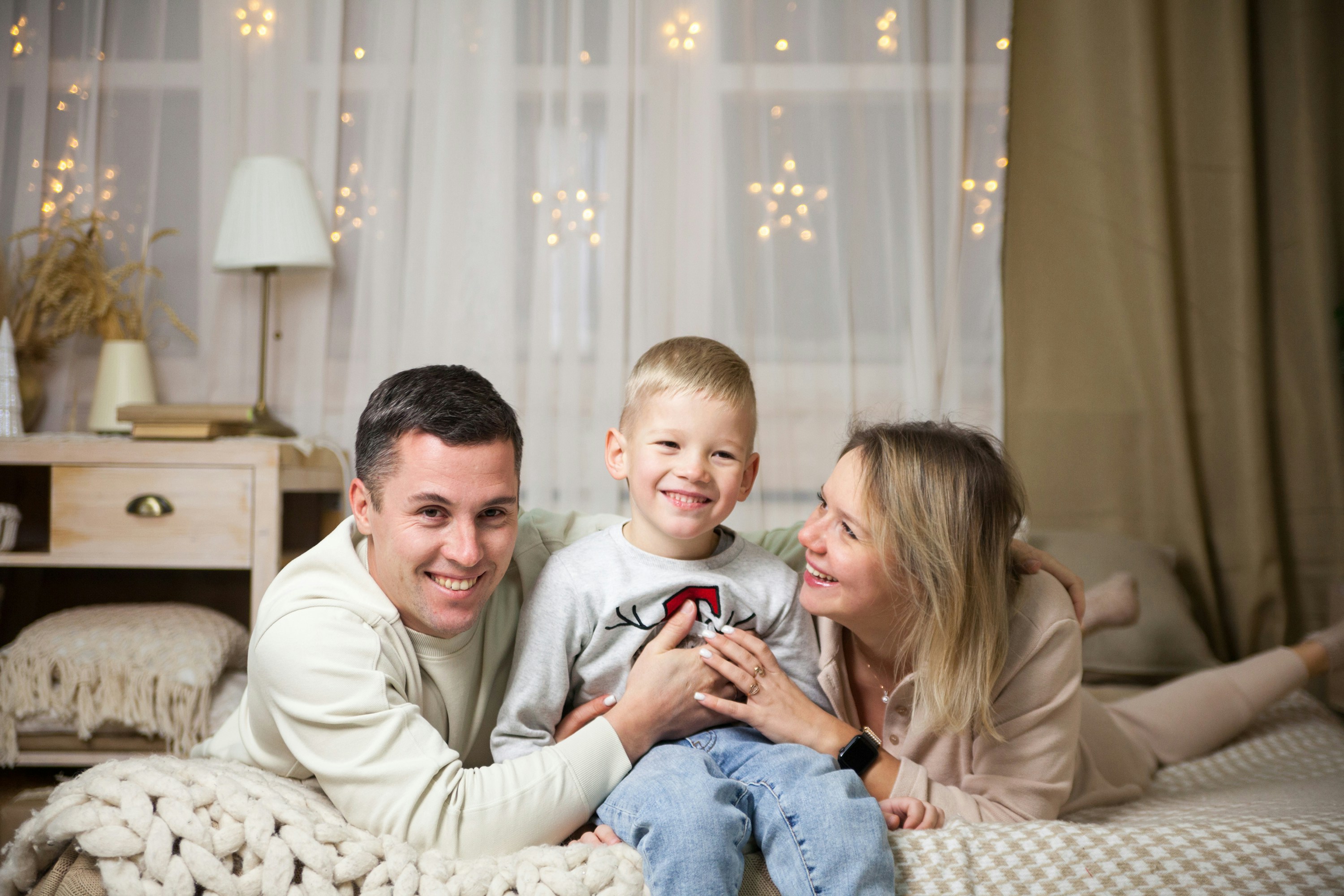 A happy family enjoying a warm and comfortable home - home furnace installation