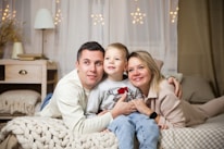 A family smiling together at home, feeling safe and protected.