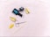 A flat lay featuring nail care items including a black nail polish bottle and a topcoat, two dried seed pods, a metal cuticle pusher, and a stick. The background is a textured light pink surface.
