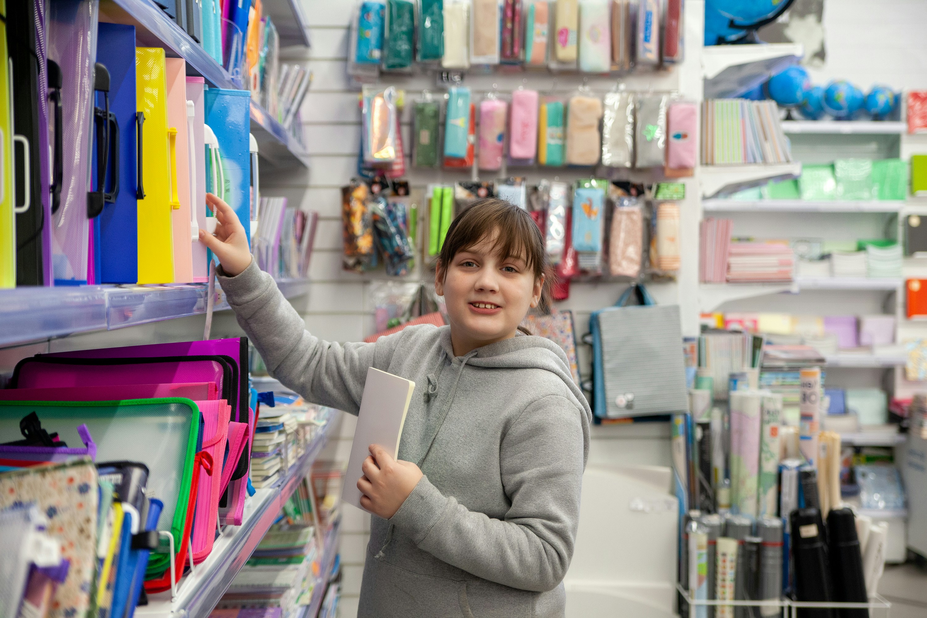 a person holding a book in a store