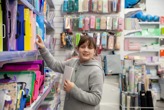 a person holding a book in a store