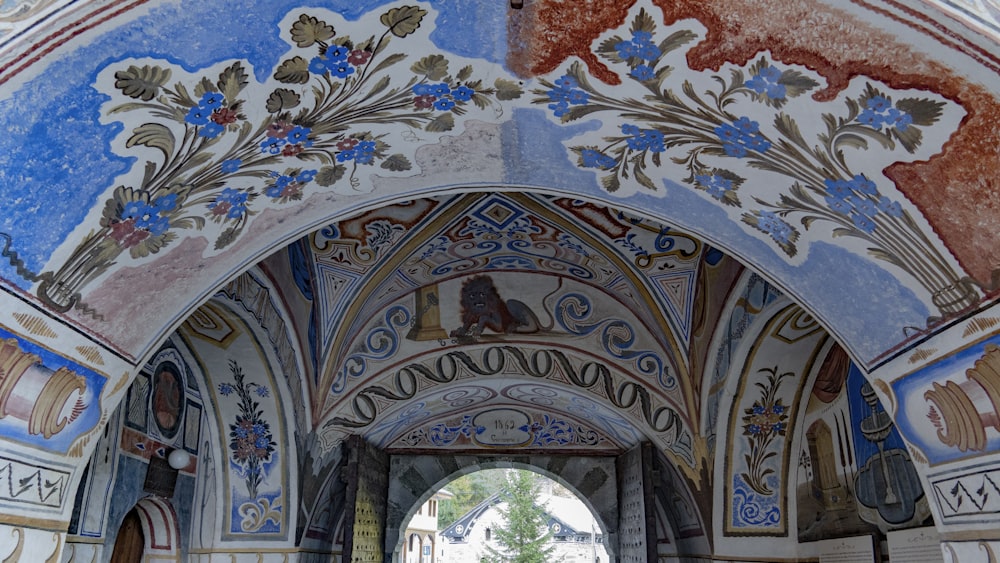 a ceiling with paintings on it