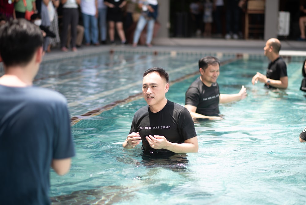 a group of men in a pool